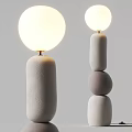 Minimalist Modern Floor Lamps With White Spherical Shades And Textured Bases