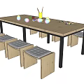 Kids Table with Wooden Top Metal Legs Stools Gray Cushions Colorful Cups Brushes