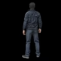 Man Standing in Black Jacket Gray T-Shirt Dark Pants and Gray Shoes on Black Background