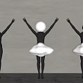 Three Black Body Sculpture Carvings With Raised Arms And Central White Cloud Shaped Skirt