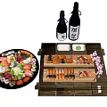 Assorted Sushi On Round Platter With Wooden Tray Sake Bottles And Small Dishes