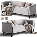 Modern Gray Fabric Two-Seater Sofa With Soft Pillows Cozy Throw Blanket And Black Wooden Legs