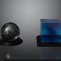 Silver Sphere with Intricate Patterns and Blue Cubes on Black Base with Reflections