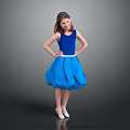 Woman In Blue Sleeveless Dress With Fluffy Skirt And White Shoes Posing In Gray Background