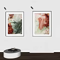 Vibrant Abstract Paintings In Black Frames Hanging On White Wall Art
