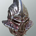 Metallic Mythical Warrior Helmet With Intricate Flame Decorations And Skull Like Face
