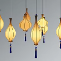 Elegant Teardrop Shaped Pendant Lights With Warm Yellow Glow And Blue Tassels Hanging