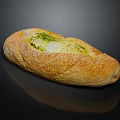 Baked Stuffed Baguette With Green Herb Filling And Sesame Seeds On Black Background