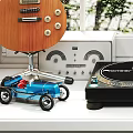 Headphones and Speakers with Vinyl Turntable in Bright Room with Green Plants