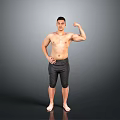 Shirtless Man Flexing Muscular Bicep In Black Shorts Against Gray Background