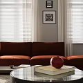 Living Room Interior With Red Sofa Window Blinds Coffee Table Pomegranate Books And Framed Artwork