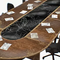 Oval Wooden Conference Table With Black Office Chairs And White Papers