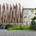 Natural Garden Ornament With Wooden Sticks Stone Wall Green Shrubs Large Rocks And Pebble Ground