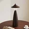 Modern Wooden Table Lamp With Tapered Base And Conical Shade On Round Table