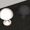 White And Silver Mushroom Shaped Table Lamps On Dark Wooden Surface