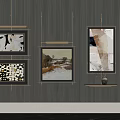 Modern Wall Art Decor With Framed Paintings On Black Background And Small Shelf Holding Vase