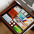 Storage Cabinet Drawer With Neatly Arranged Medical Supplies And Medicine Boxes