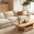 Beige Sofa And Wooden Coffee Table Set With Green Plant And Natural Light