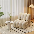 Cozy Living Room Corner With Beige Caterpillar Sofa Small White Table And Large Leaf Plant