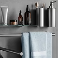 Sleek Modern Bathroom Accessories With Towel Bars Towels Aromatherapy Sticks And Toiletries On Gray Wall