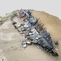 Abandoned Rusted Metal Construction Components With Scattered Stones And Sandy Soil