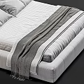 Modern Double Bed With Upholstered Headboard Soft Pillows And Striped Bedding With Knitted Blanket