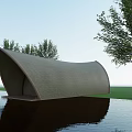 Scenic Modern Curved Architectural Structure With Textured Gray Surface And Water Reflection Near Trees