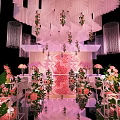 Banquet Hall Interior With Curved White Strip Ceiling And Pink White Flower Arrangements