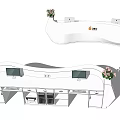 Modern Curved White Reception Desk With Computer Monitors Flower Arrangements And Storage Cabinets