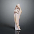 Woman Statue In Flowing Robe Embracing Child On Dark Shiny Surface