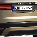 Silver Land Rover Discovery SUV With Headlights And License Plate