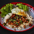 Delicious Rice Bowl With Minced Meat Fried Egg And Fresh Lettuce On Red Plate