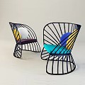 Modern Leisure Chairs Featuring Black Metal Frame Colorful Cushions And Circular Decorations