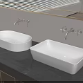 White Above Counter Bathroom Washbasins On Dark Countertop With Wall Mounted Faucets And Mirror