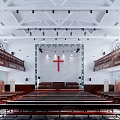 Religious Church Interior Featuring Wooden Pews Stained Glass Windows Two Level Balconies And Chandeliers