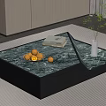 Stylish Marble Top Coffee Table With Black Base Fresh Fruits Book Vase And Green Plant