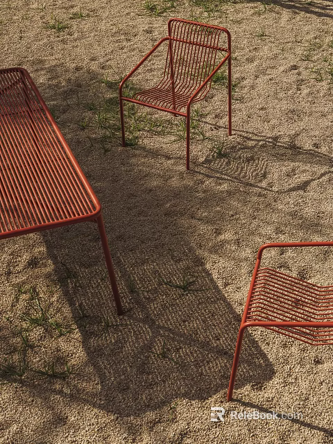 Outdoor Red Woven Table and Chair Set on Sandy Ground with Grass and Sunlight Shadows 3d model 