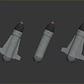 Three Metallic Military Bombs with Red Tips and Fins on Reflective Surface