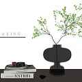 Relaxing Decorative Ornament Set Featuring Glass Vase Green Foliage Books and Wooden Tabletop