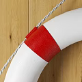 White And Red Circular Lifebuoy Sports Equipment Hanging On Wooden Background