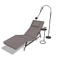 Modern Upholstered Lounge Chair With Black Metal Frame And Floor Lamp In Indoor Relaxation Space