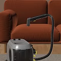 Vacuum Cleaner With Hose Cleaning Orange Sofa Upholstery Surface Smoothly At Home
