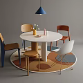 Modern Round Table and Chairs Set with Colorful Seats Circular Rug and Blue Pendant