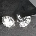 Oval Transparent Sparkling Diamonds With Brilliant Cut Facets On Black Background