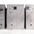 Industrial Control Cabinets Silver Metal Enclosures with Display Screens Control Panels and Warning Signs