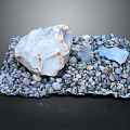 Natural Stone Display With Large White Stone And Small Pebbles On Dark Background
