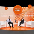XTransfer Future Foreign Trade Conference Photo Check In Spot With Orange Background And White Chairs