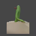 Green Plush Game Movie Character Sitting With Big Eyes Open Mouth And Teeth