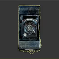 Vintage Electronic Camera Featuring Blue Green Metal Body Foldable Structure And Worn Texture