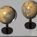Decorative Globe Ornament Set With Two Beige Globes Dark Bases And Colored Maps